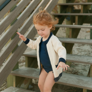 unisex cream and navy trim knit cardigan