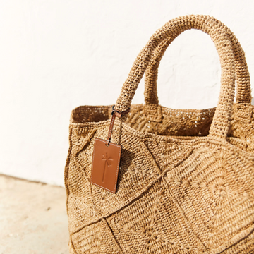 manebi large tan raffia sunset bag